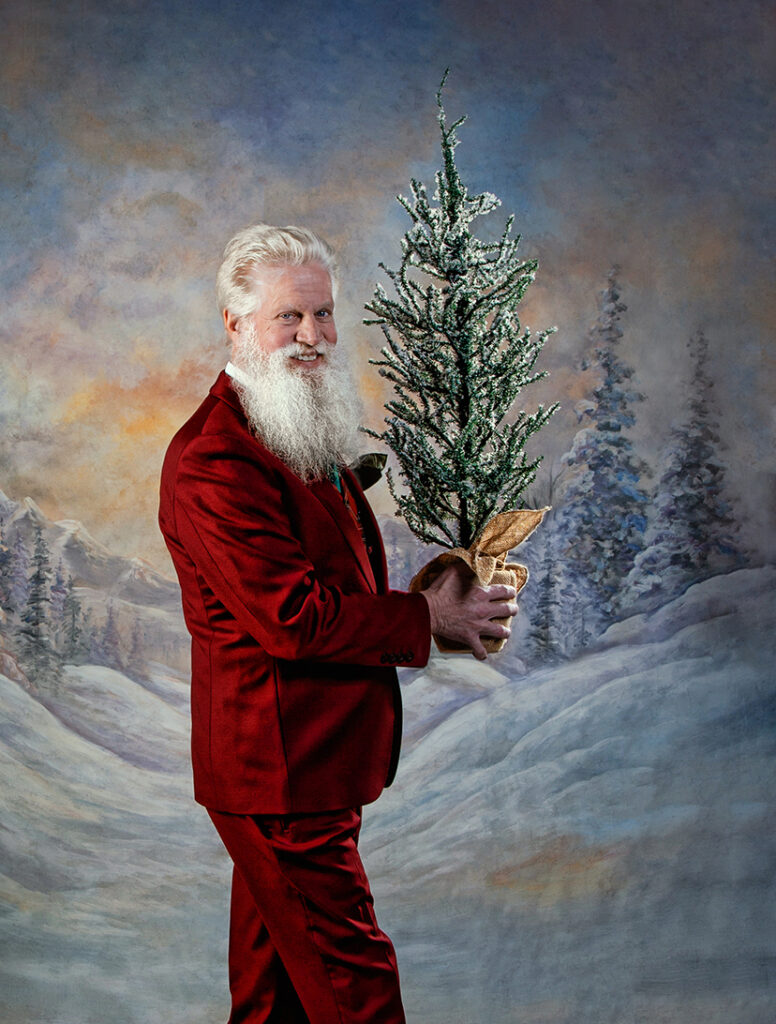 Santa Boe from St. Paul and Minneapolis, Minnesota or Twin Cities metro area as a modern, trendy, hipster, tailored GQ Santa Claus.