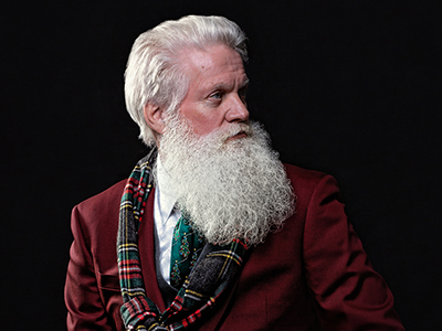 Santa Boe from St. Paul and Minneapolis, Minnesota or Twin Cities metro area as a modern, trendy, hipster, tailored GQ Santa Claus.